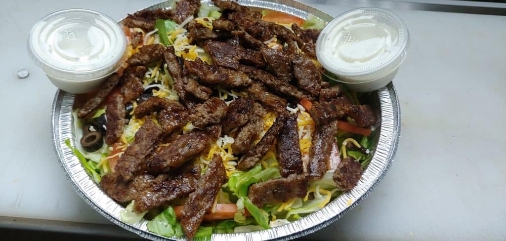 O Town Burgers Halal Food Restaurants in Orlando Florida a gyro dish prepared 