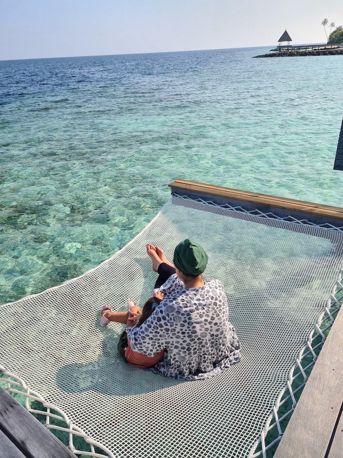 S and MuslimTravelGirl in Maldives WA after earning a million hilton points